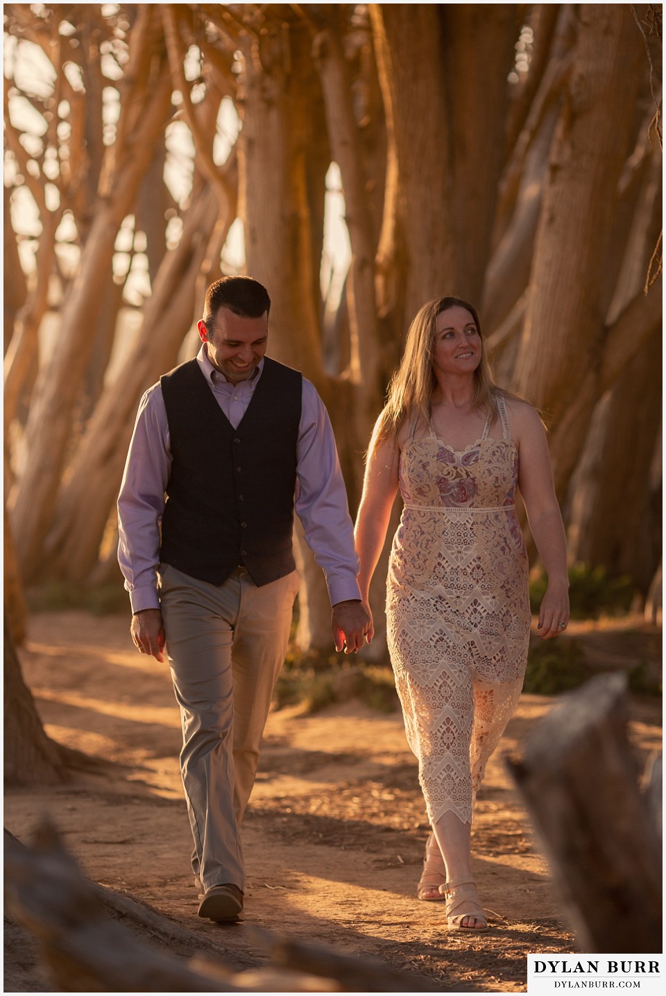 santa cruz california elopement wedding adventure bride and groom walking in cypress trees together