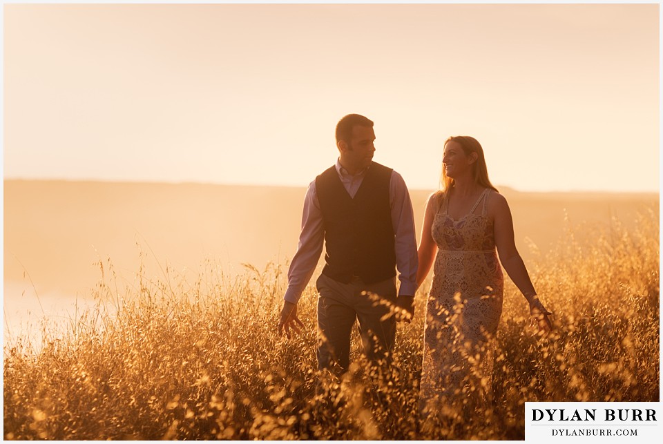 santa cruz california elopement wedding adventure bride and groom walking together at sunset