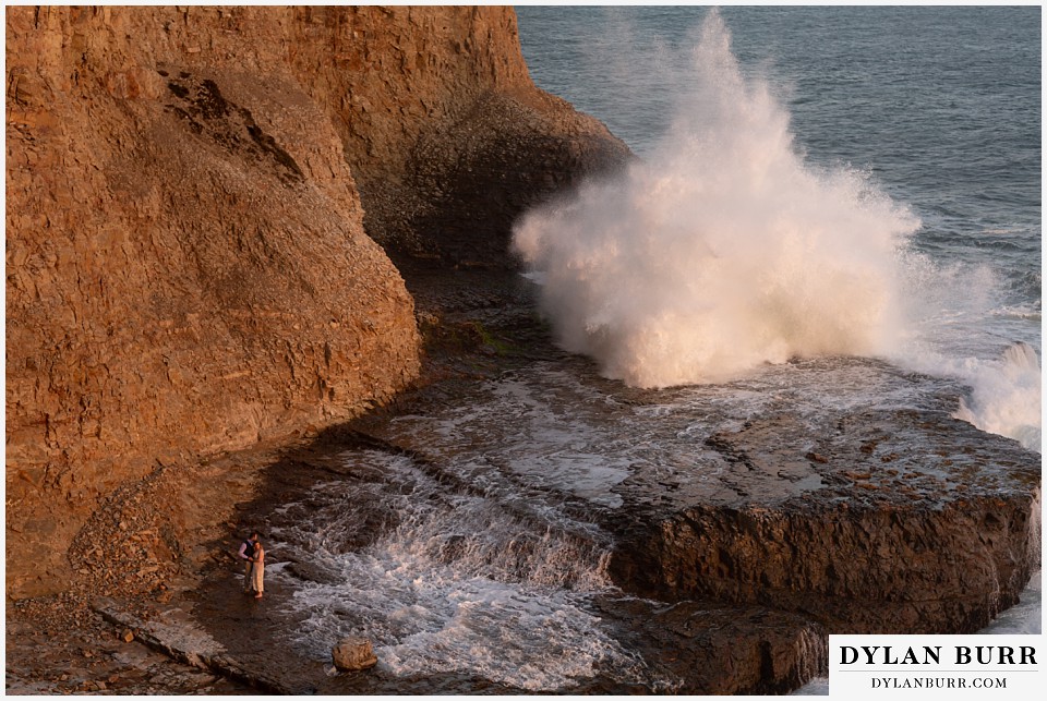 santa cruz california elopement wedding adventure bride and groom at ocean cliffs with giant waves