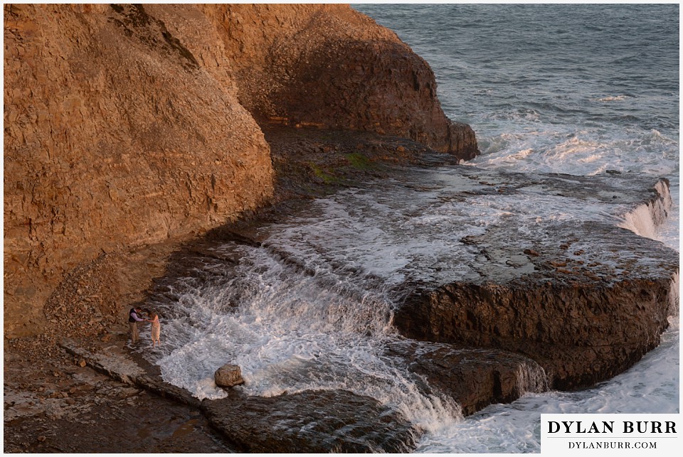 santa cruz california elopement wedding adventure bride and groom get a little wet from the ocean waves