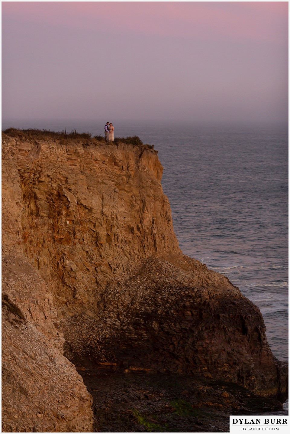 santa cruz california elopement wedding adventure bride and groom on top of cliffs at sunset