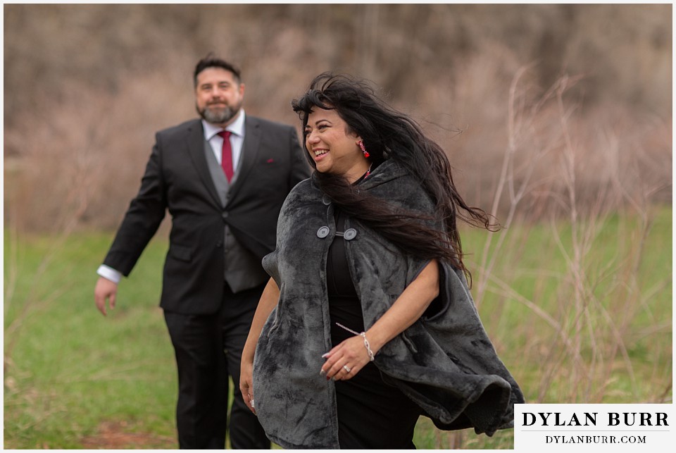 snowmass colorado wedding elopement at bride and groom playing together in a park