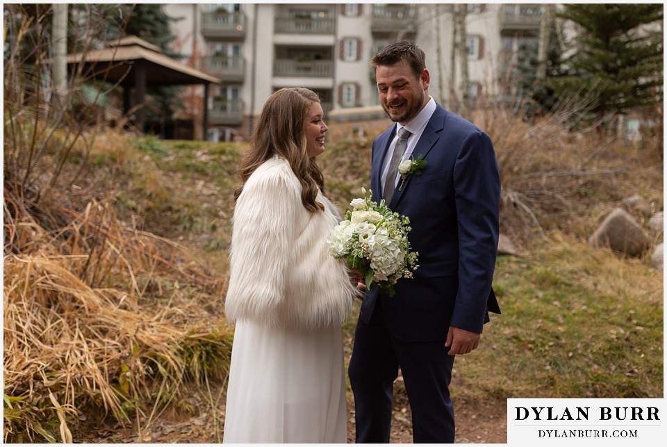 sonnenalp vail wedding bride and groom laughing during first look