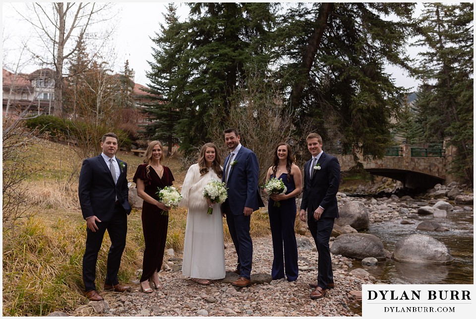 sonnenalp vail wedding bridal party alongside the river