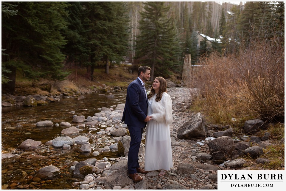 sonnenalp vail wedding bride and groom together near the creek