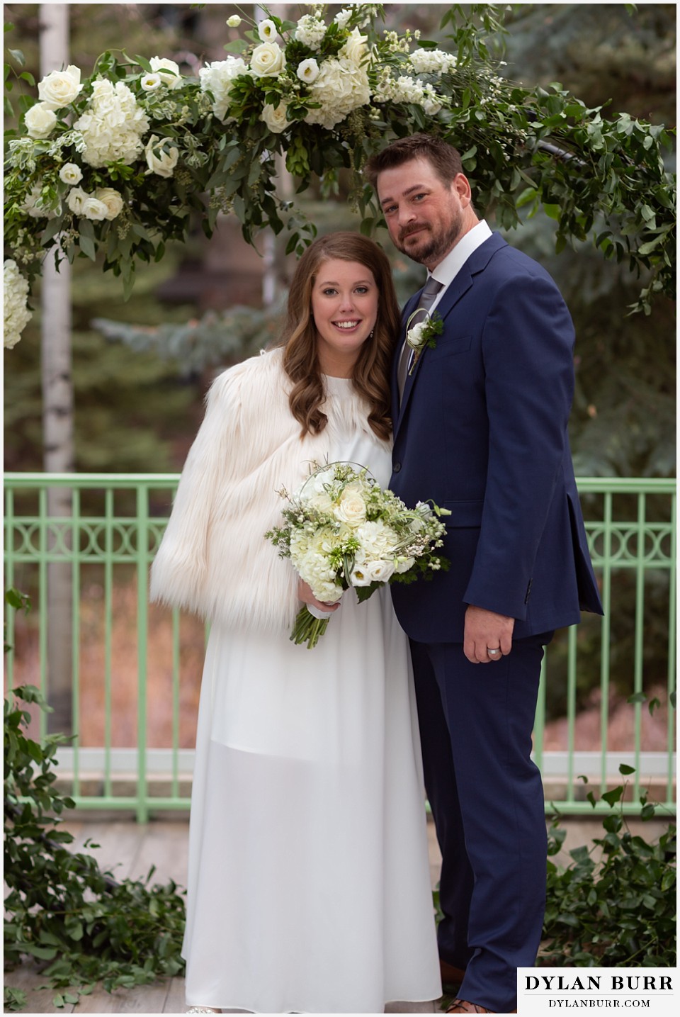 sonnenalp vail wedding bride and groom near flower arbor