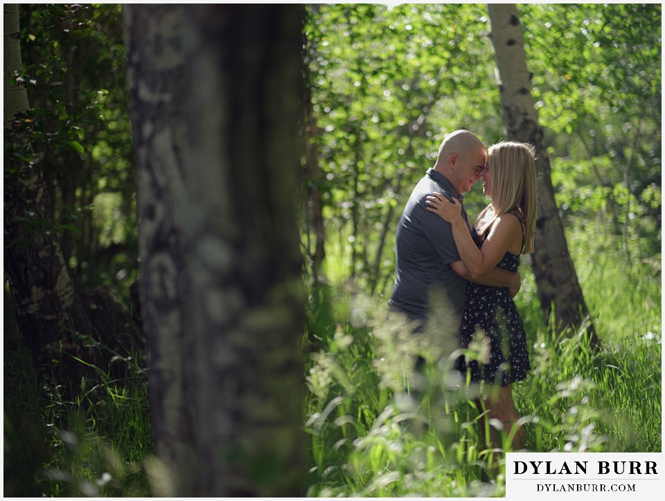 couple so in love during spring engagement photo session in the mountains