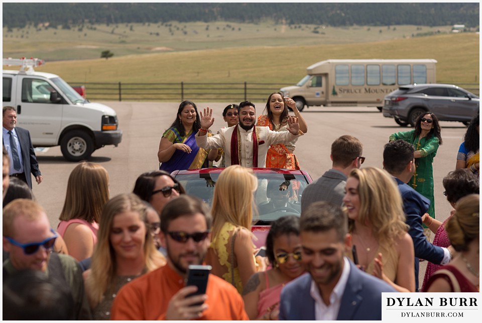 spruce mountain ranch wedding indian wedding groom baraat's in convertable car