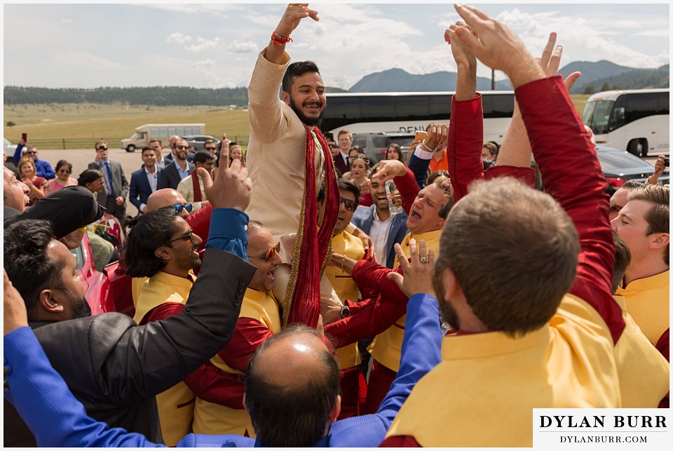 spruce mountain ranch wedding indian wedding groomsmen holding up groom