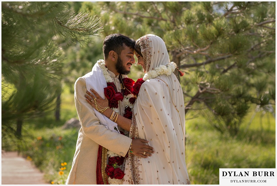 spruce mountain ranch wedding indian wedding bride and groom lovingly looking at eachother