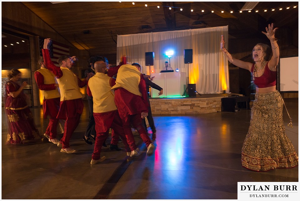 spruce mountain ranch wedding indian wedding bride calling everyone to the dance floor