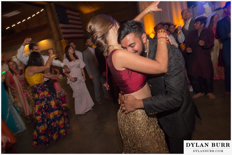 spruce mountain ranch wedding indian wedding groom snuggling wife