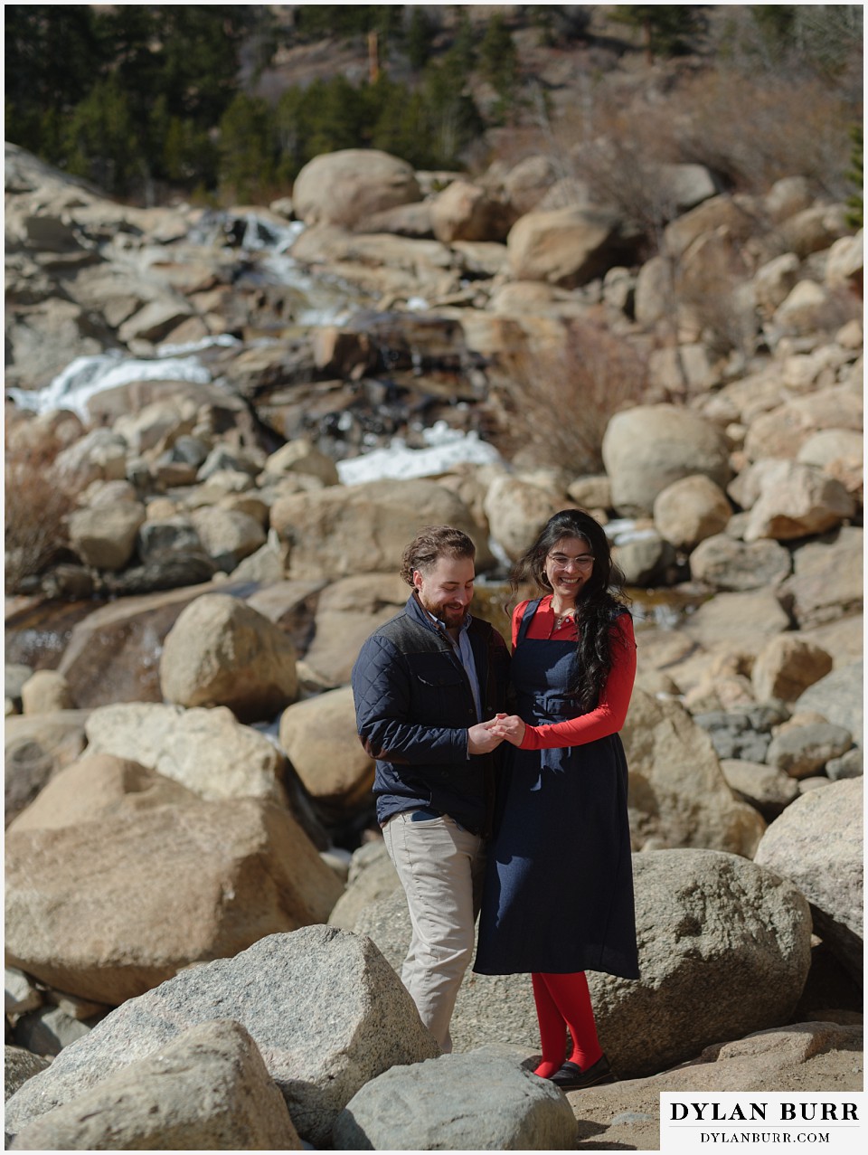 newly engaged couple with shelly duvall style near waterfall