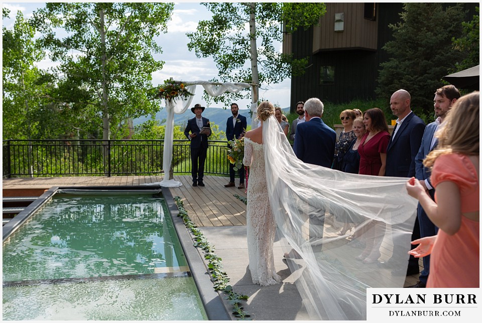 wedding ceremony by the pool in steamboat colorado