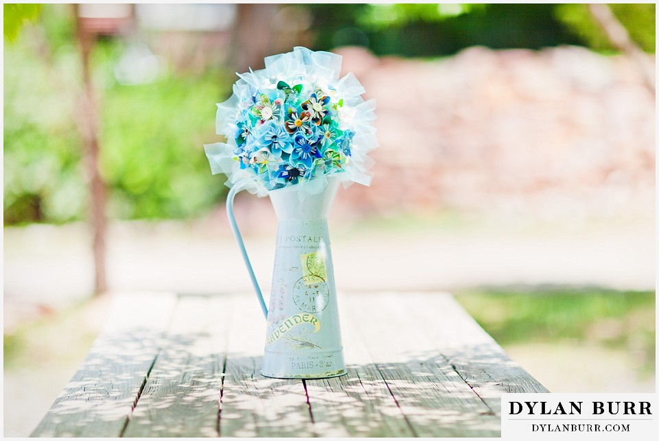 stone mountain lodge wedding blue origami paper bouquet in metal vase