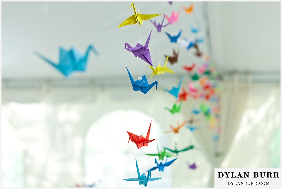 stone mountain lodge wedding paper origami cranes hanging from ceiling