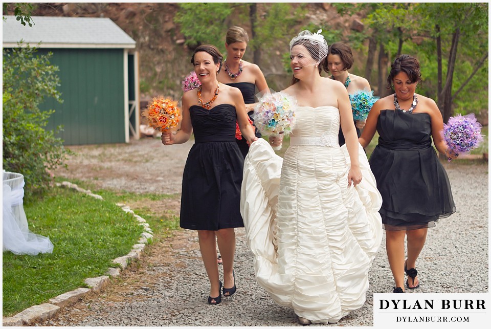 stone mountain lodge wedding bride and bridesmaids walking along lake