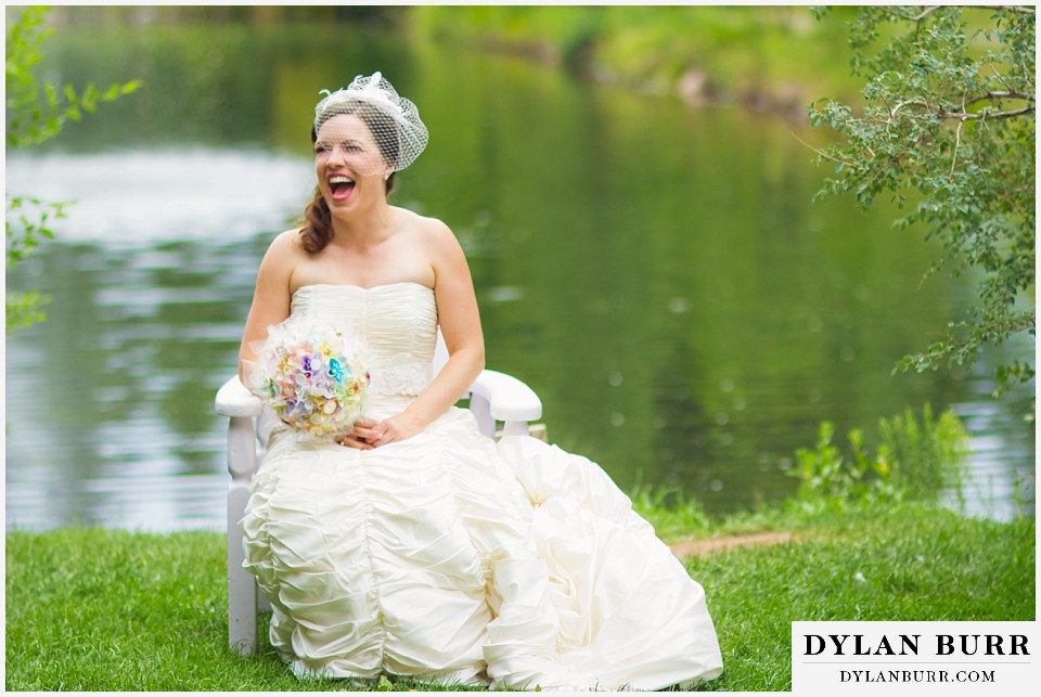 stone mountain lodge wedding bride laughing near lake