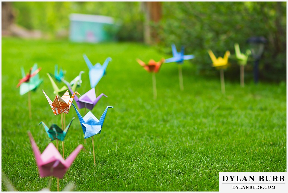 stone mountain lodge wedding paper origami cranes leading the way to ceremony location