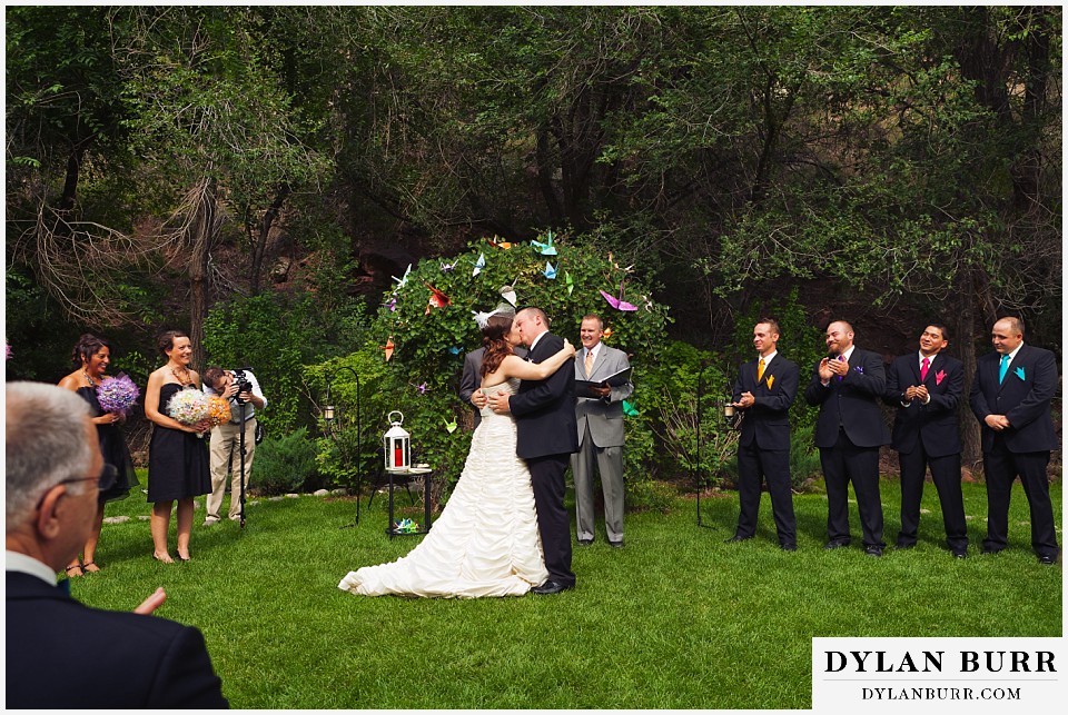 stone mountain lodge wedding bride and groom's first kiss