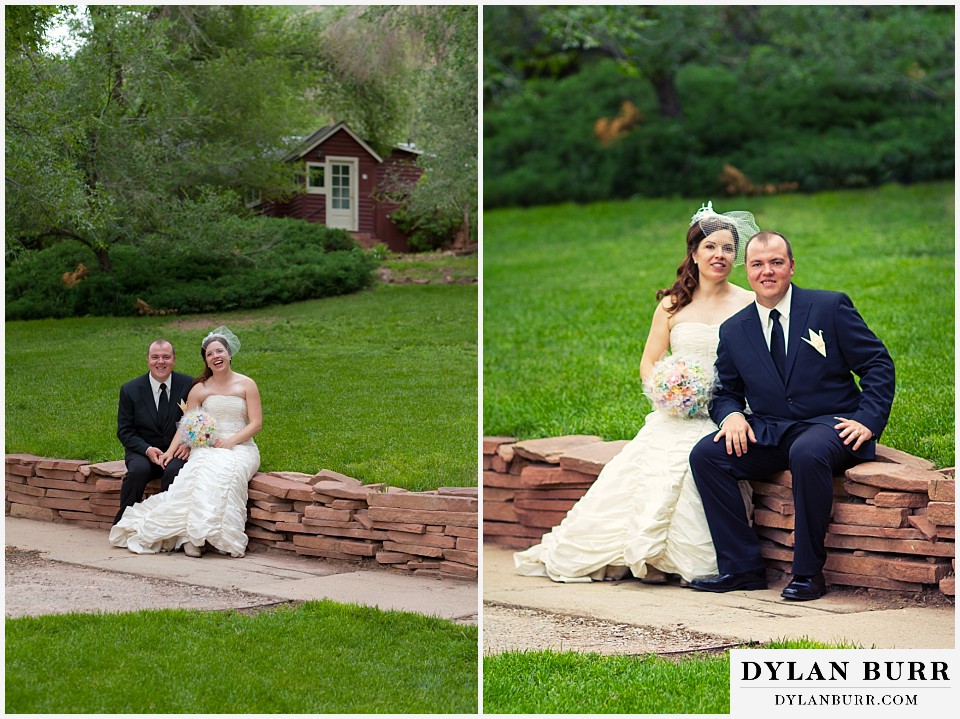 stone mountain lodge wedding bride and groom sitting together on red stone wall