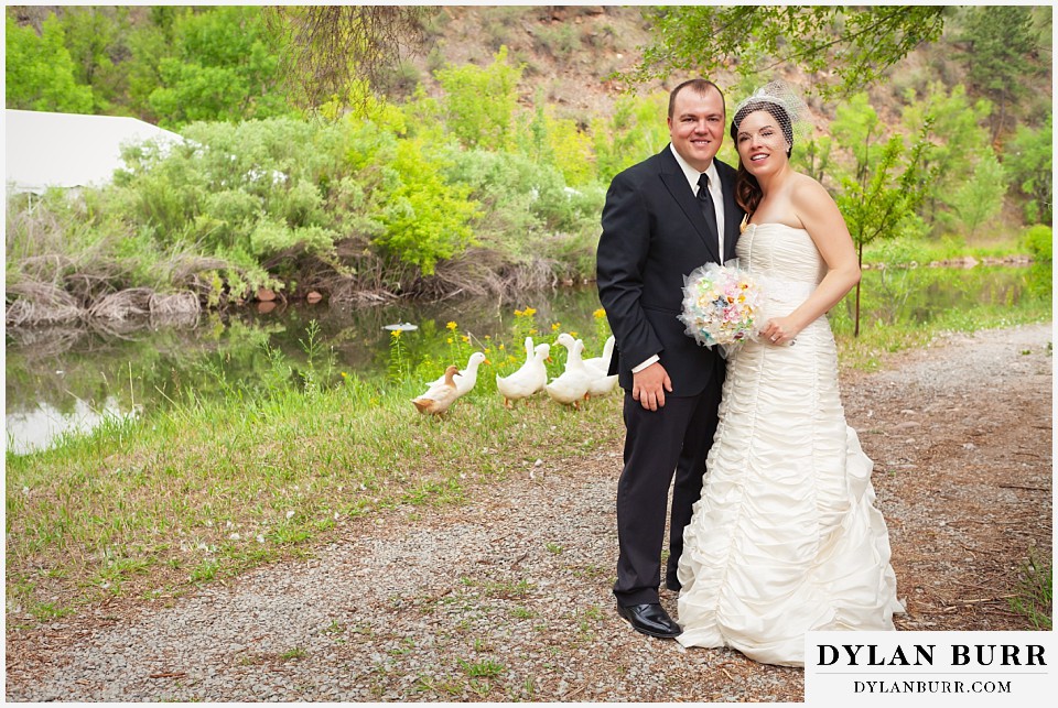 stone mountain lodge wedding bride and groom near lake with ducks