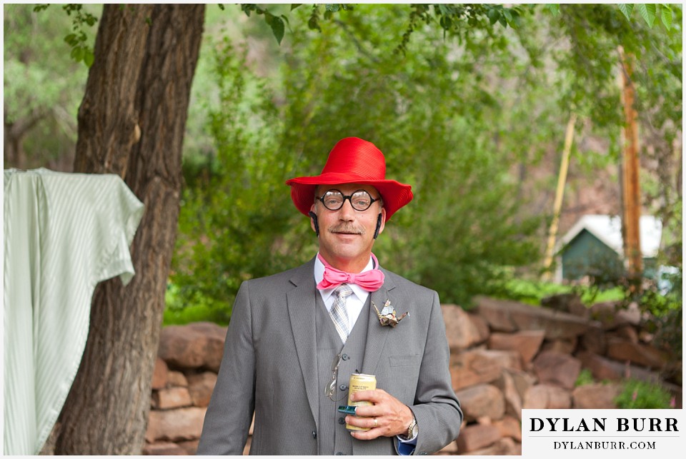 stone mountain lodge wedding grooms dad being goofy with photobooth props