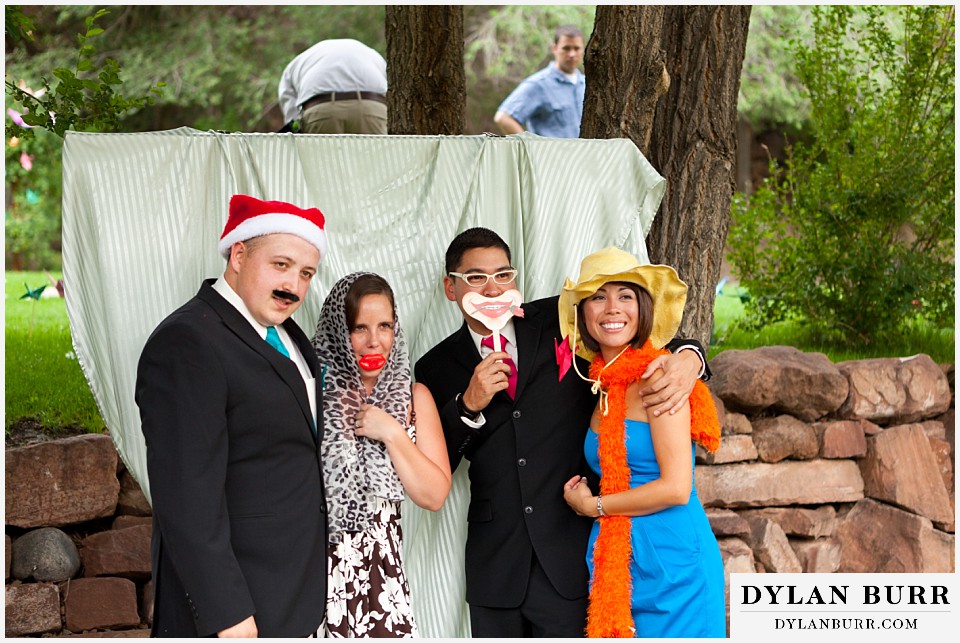 stone mountain lodge wedding friends in photobooth having fun