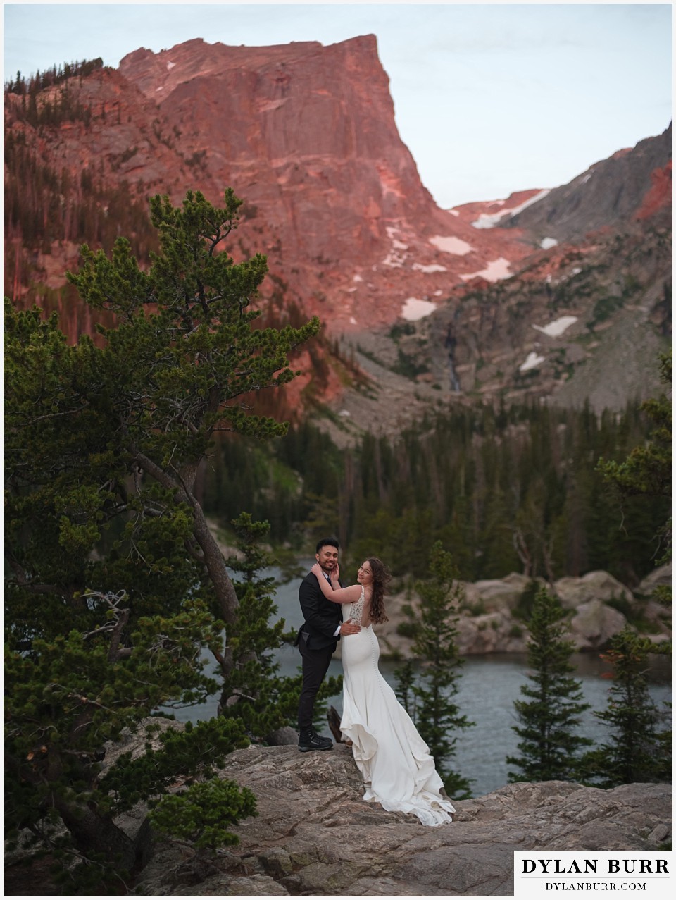 sunrise hike elopement to dream lake pink sunrise colors on Hallett Peak