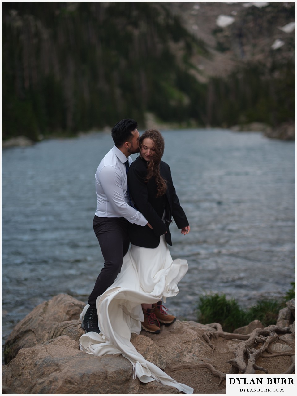 sunrise hike elopement to dream lake fighting the challenging wind at the lake