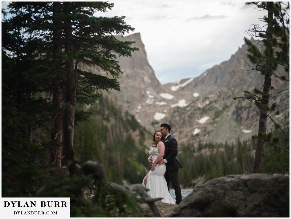 sunrise hike elopement to dream lake having a calm moment together