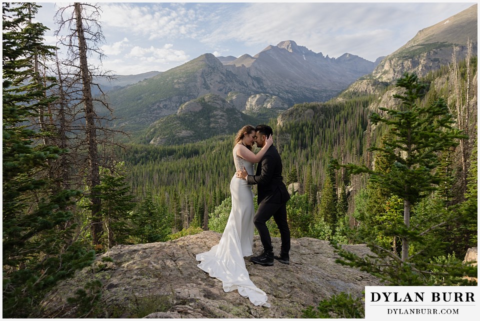 sunrise hike elopement to dream lake a sweet close moment with longs peak in distance