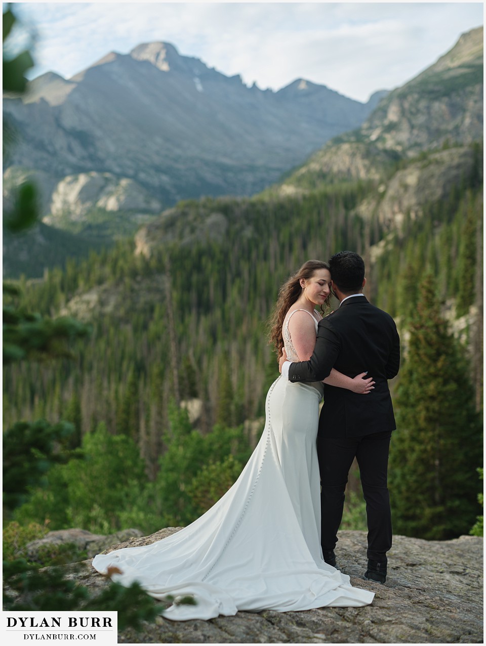sunrise hike elopement to dream lake together with mountain peaks in distance