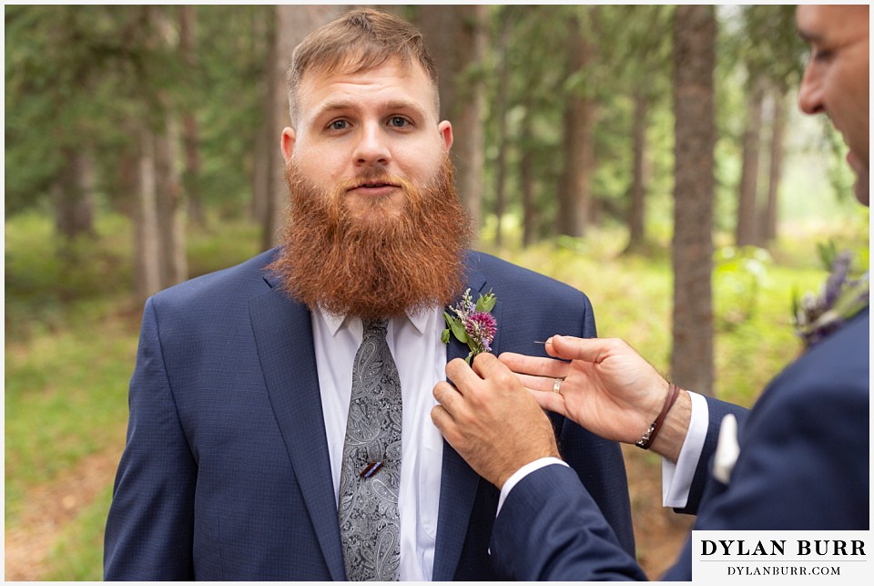 telluride colorado elopement wedding adventure best man putting on boutonniere