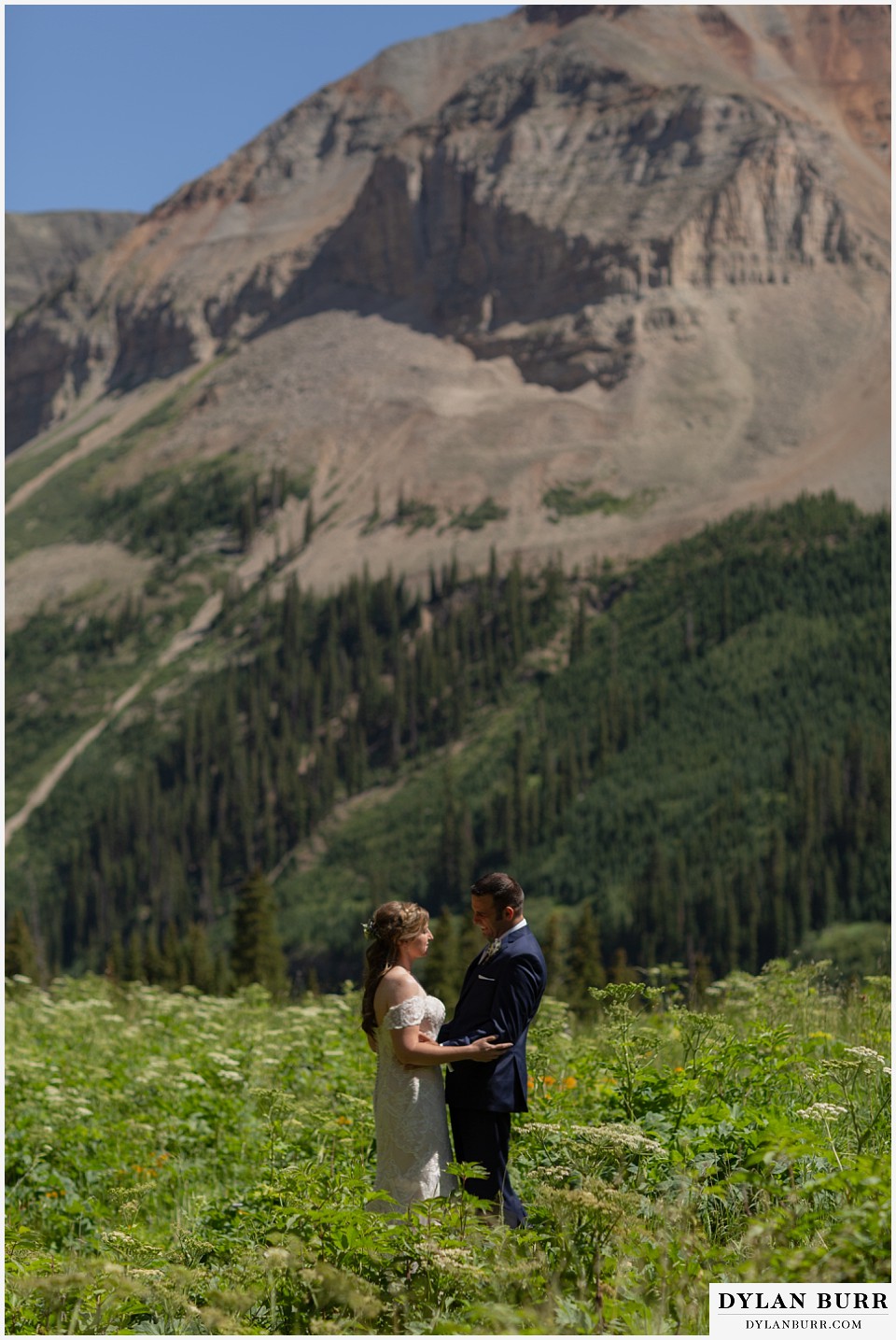 telluride colorado elopement wedding adventure first look standing in field