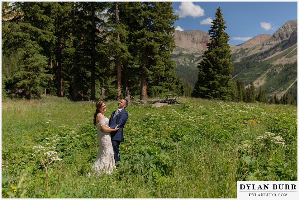 telluride colorado elopement wedding adventure bride and groom first look laughing together