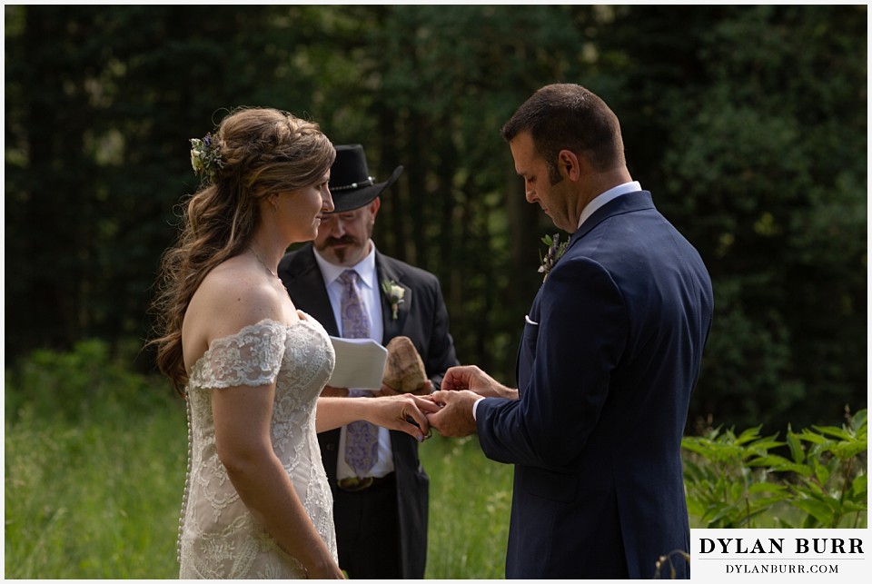 telluride colorado elopement wedding adventure exchaning wedding rings bride