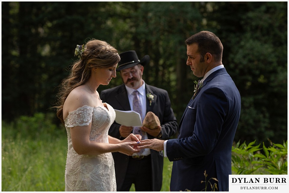 telluride colorado elopement wedding adventure exchanging wedding rings groom