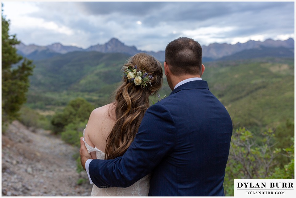 telluride colorado elopement wedding adventure  bride and groom look out at mount sneffels near ridgeway