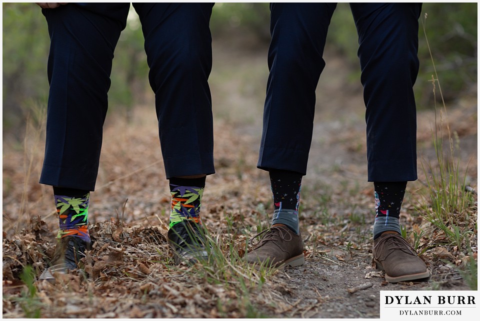 telluride colorado elopement wedding adventure groom and best man show off their funky socks