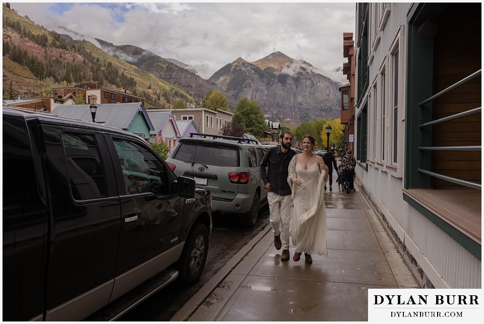 telluride trout lake elopement wedding bride and groom walking together in Telluride