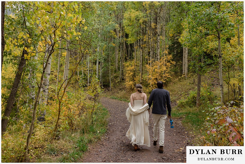 telluride elopement wedding hiking together in fall aspen forest