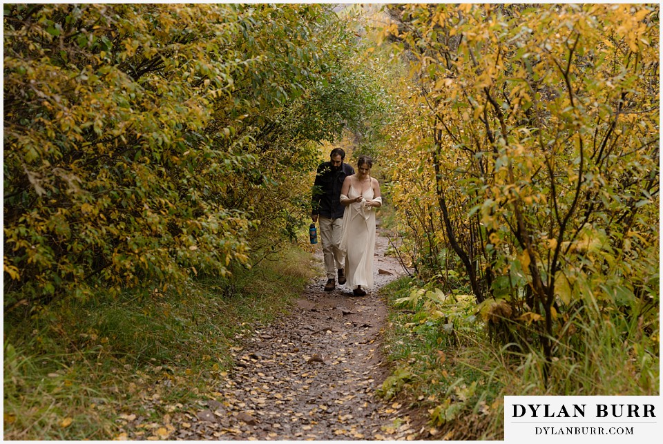 telluride elopement wedding bride and groom in mini fall tree tunnel