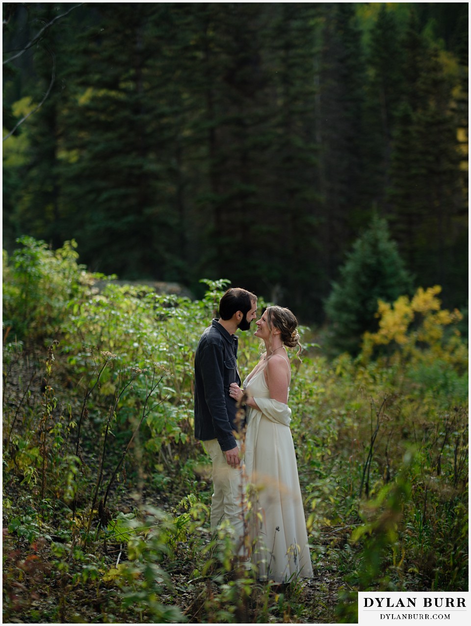 telluride elopement wedding bride and groom pausing on mountain trail in some nice light