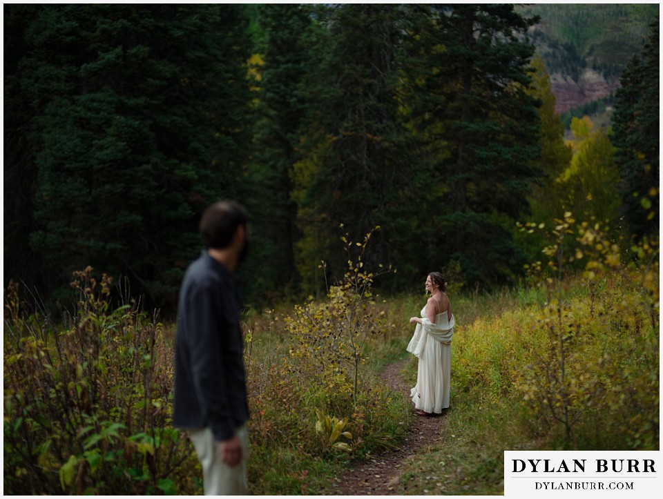 telluride elopement wedding hiking together bride looking back at groom