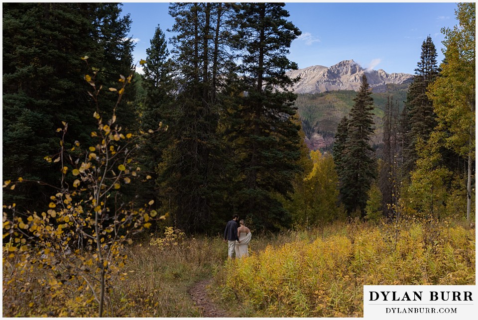 telluride elopement wedding bride and groom together with big mountain views in fistance