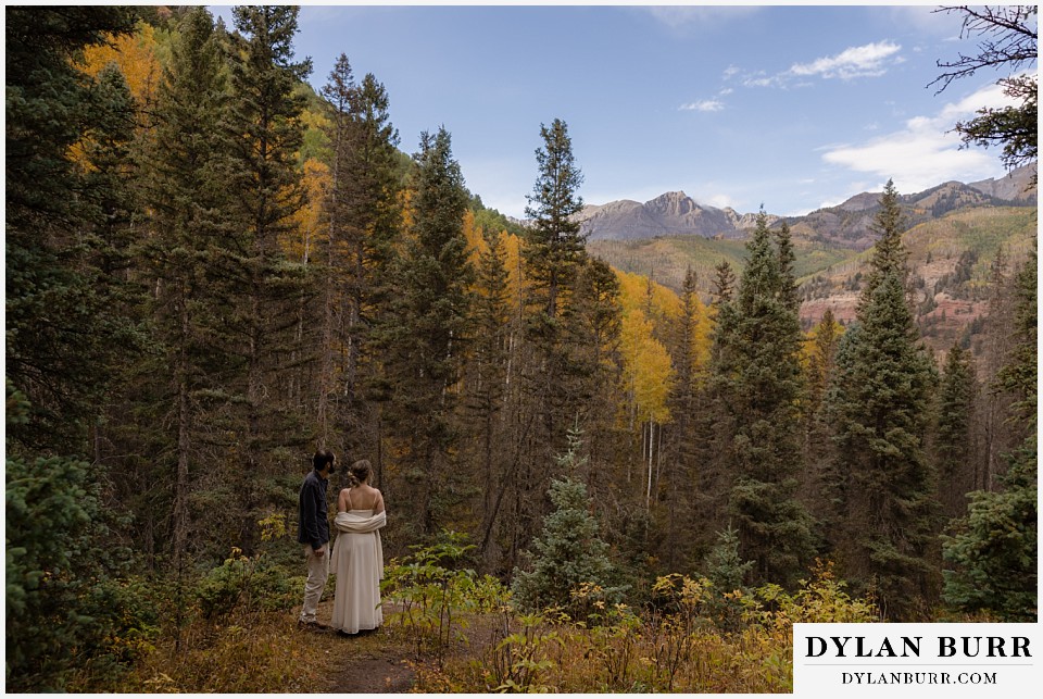telluride elopement wedding bride and groom at an opening enjoying the view