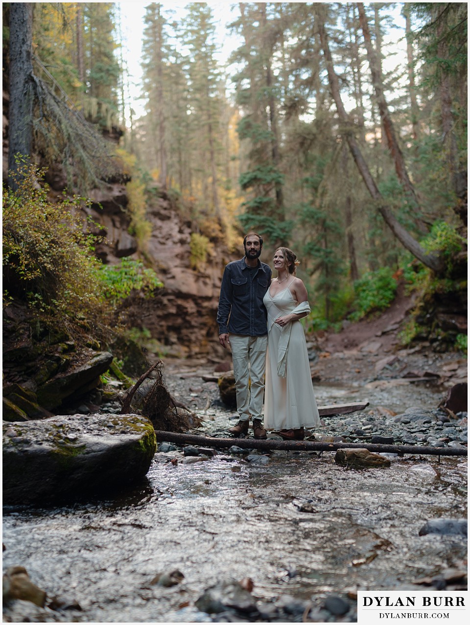 telluride elopement wedding newlywed couple standing together in the river