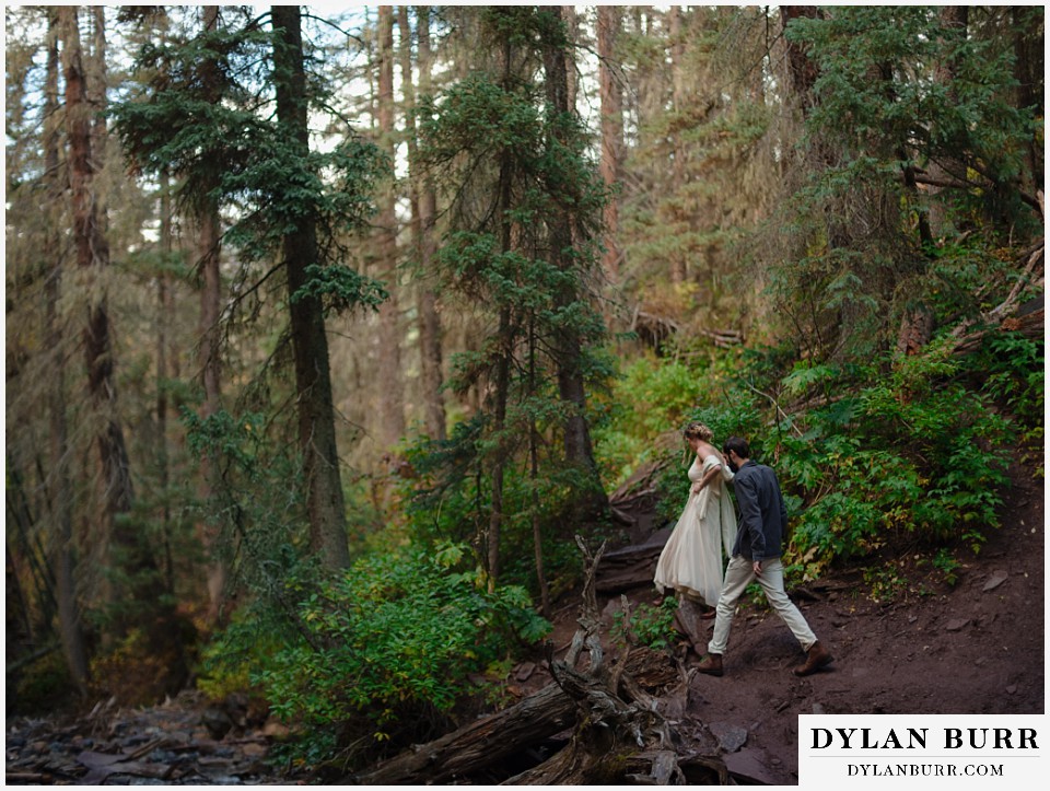 telluride elopement wedding bride and groom hiking out together
