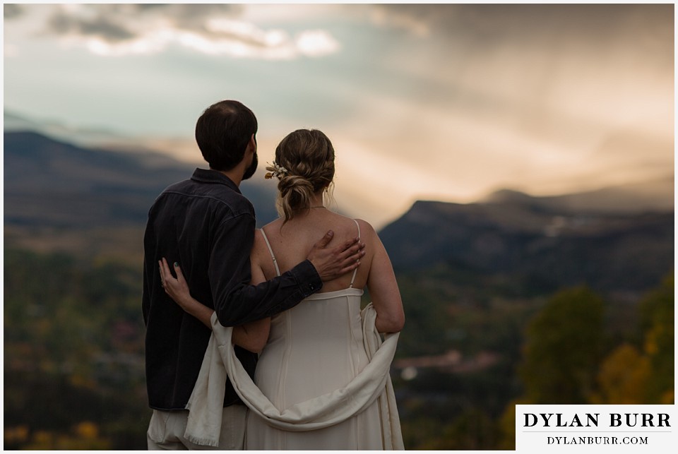 telluride elopement wedding couple enjoying the sunset and rain storms